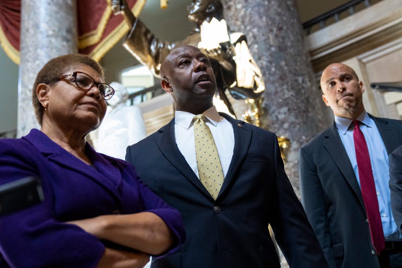 From left: Rep. Karen Bass (D-CA), Sen. Tim Scott (R-SC), and Sen. Cory Booker (D-NJ)