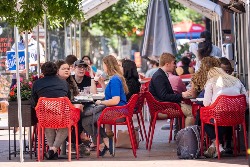 Restaurant patrons eat outside during lunch hour on Pennsylvania Avenue in the Capitol Hill neighborhood in Washington, D.C.