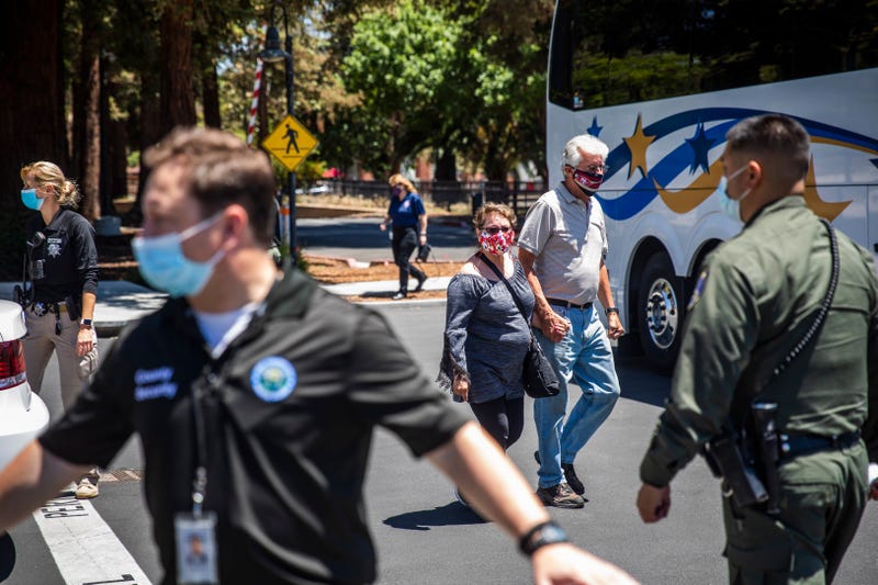 People leave a gathering point for family members and VTA employees on May 26, 2021 in San Jose, California.
