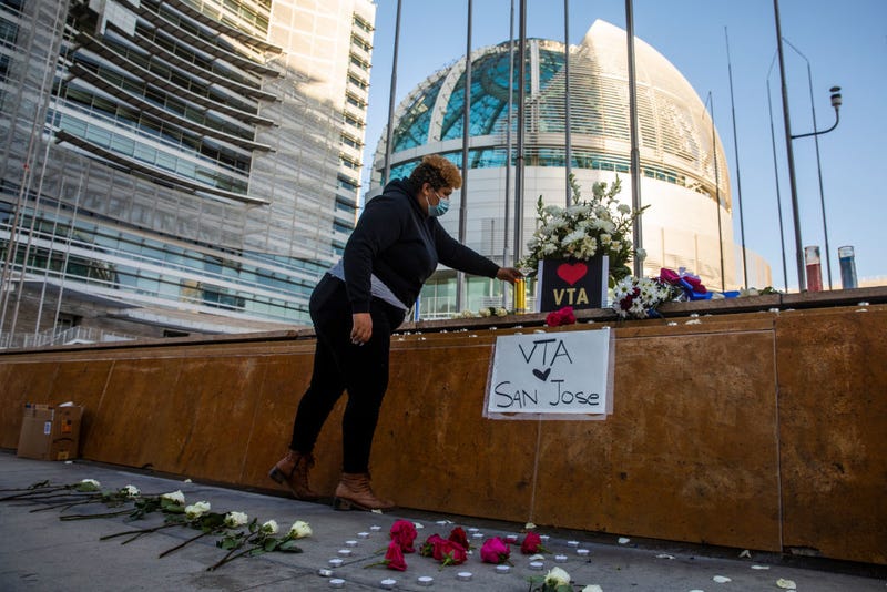 HERO Tent President Kiana Simmons places a candle at a vigil organized by her group following the mass shooting at the Valley Transportation Authority (VTA) light-rail yard, outside City Hall on May 26, 2021 in San Jose, California.