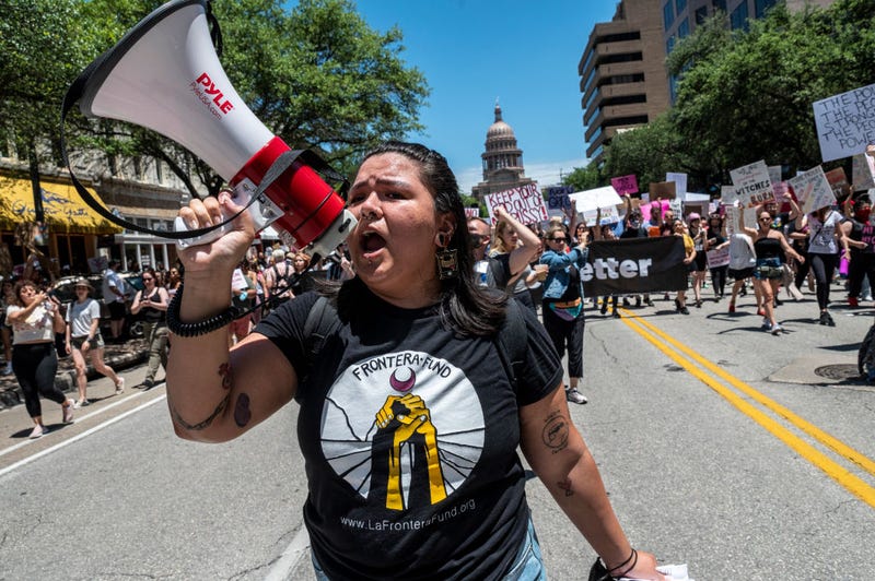 Thousands of people protested a new bill outlawing abortions after a fetal heartbeat is detected outside the Texas State Capitol on May 29, 2021.