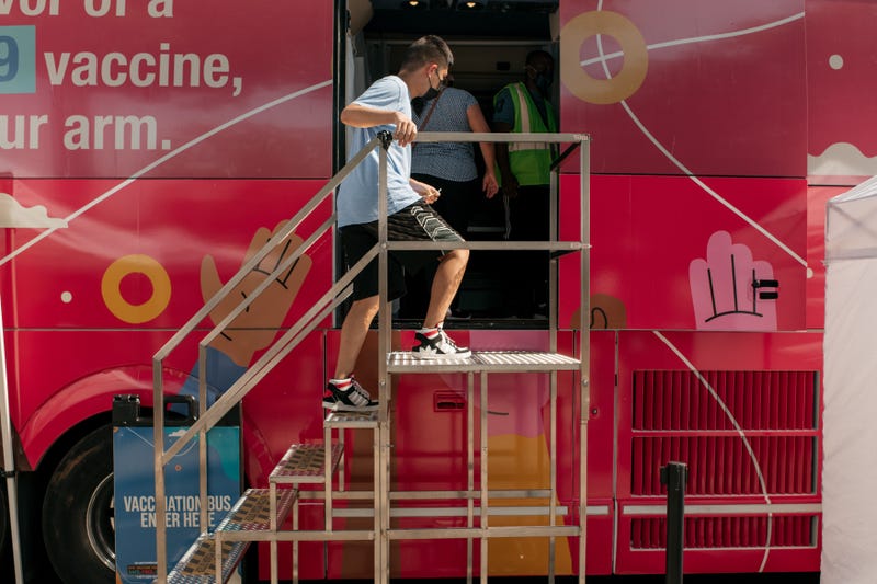A teenager enters a pop-up COVID-19 vaccine site on June 5, 2021 in the Jackson Heights neighborhood in the Queens borough in New York City