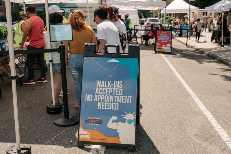 File photo: Families visit a pop-up COVID-19 vaccine site and block party on June 5, 2021 in the Jackson Heights neighborhood in the Queens borough in New York City