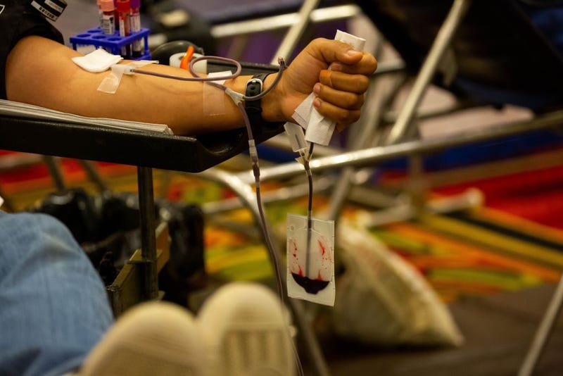 A donor gives blood at an emergency blood drive hosted by the NYBC and the New York Islanders on World Blood Donor Day in Uniondale, New York on June 14, 2021.
