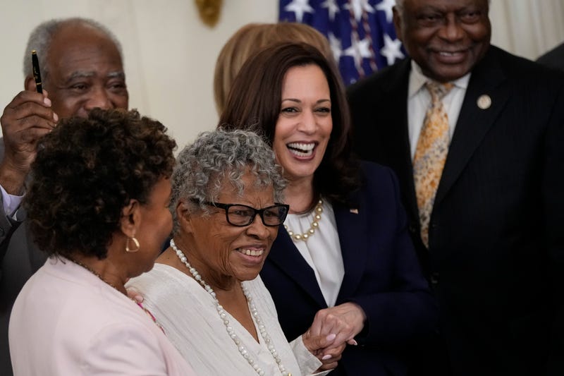 94-year-old activist and retired educator Opal Lee, known as the Grandmother of Juneteenth, holds hands with Vice President Kamala Harris as U.S. President Joe Biden signs the Juneteenth National Independence Day Act into law in the East Room of the White House on June 17, 2021 in Washington, DC.