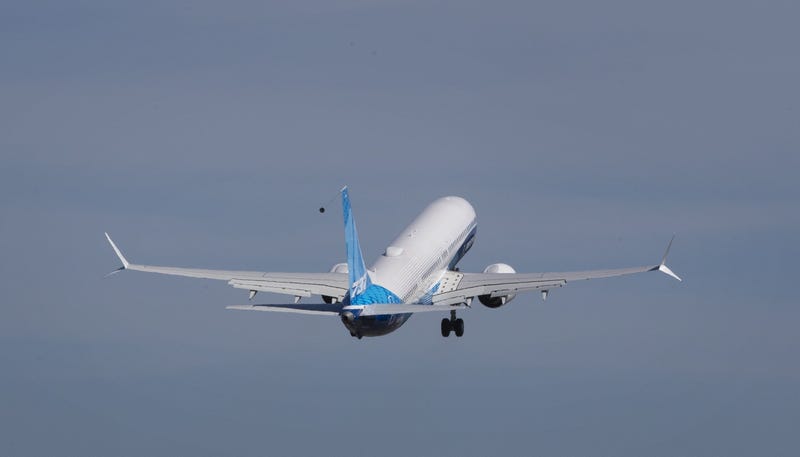 A Boeing airliner takes off.