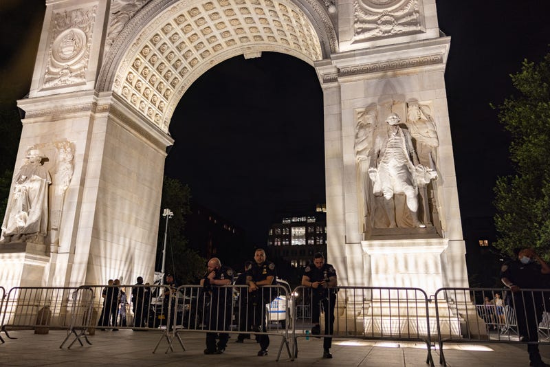 File photo: Police set up a perimeter beneath the archway of Washington Square Park on June 18, 2021 in New York City