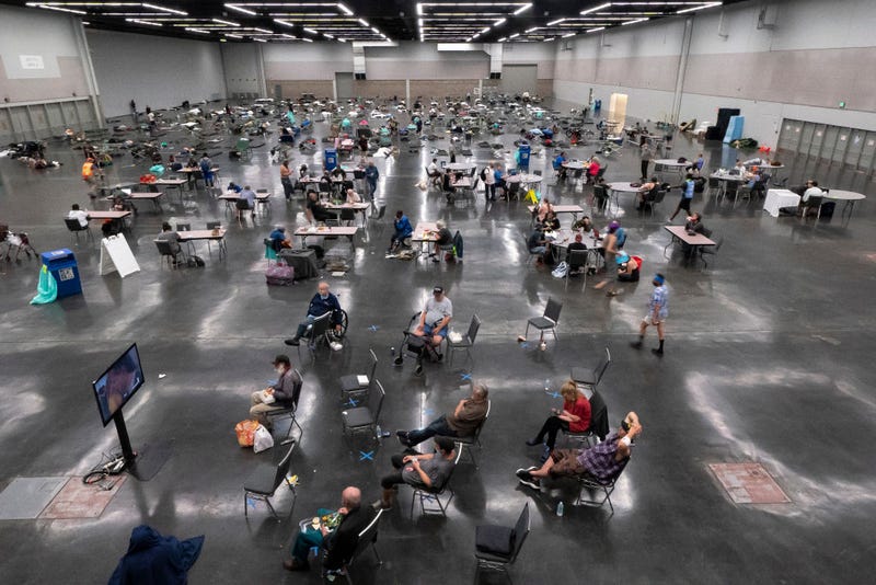 Portland residents fill a cooling center with a capacity of about 300 people at the Oregon Convention Center June 27, 2021 in Portland, Oregon.