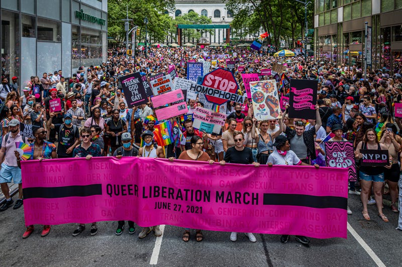 Participants seen marching behind a banner in New York City on June 27, 2021. Thousands of New Yorkers took to the streets of Manhattan to participate on the Reclaim Pride Coalition's third annual Queer Liberation March, where no police, politicians or corporations were allowed to participate. 