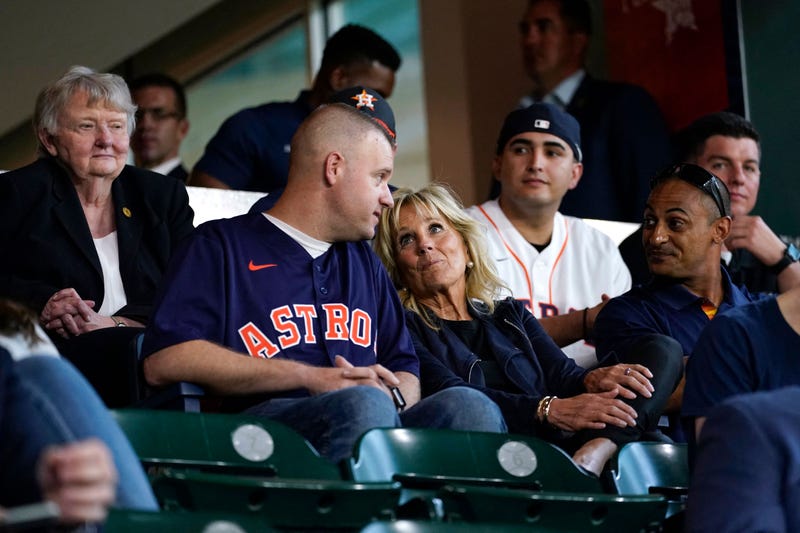First lady Jill Biden and Second Gentleman Doug Emhoff (off frame) sit with military members and first responders as they attend a baseball game between the Houston Astros and the Baltimore Orioles at Minute Maid Park, in Houston, Texas, on June 29, 2021. 
