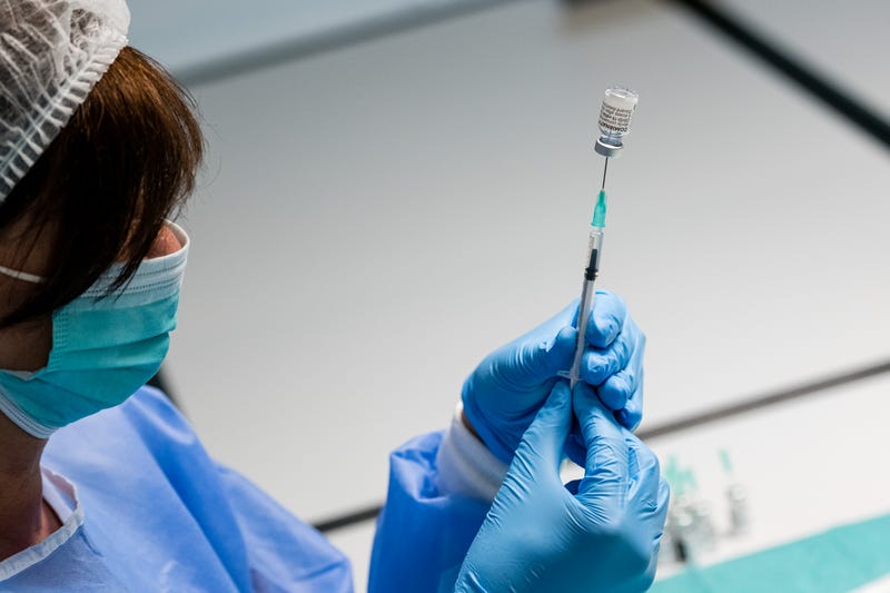 A German nurse prepares syringes that contain the Pfizer/BioNTech vaccine.