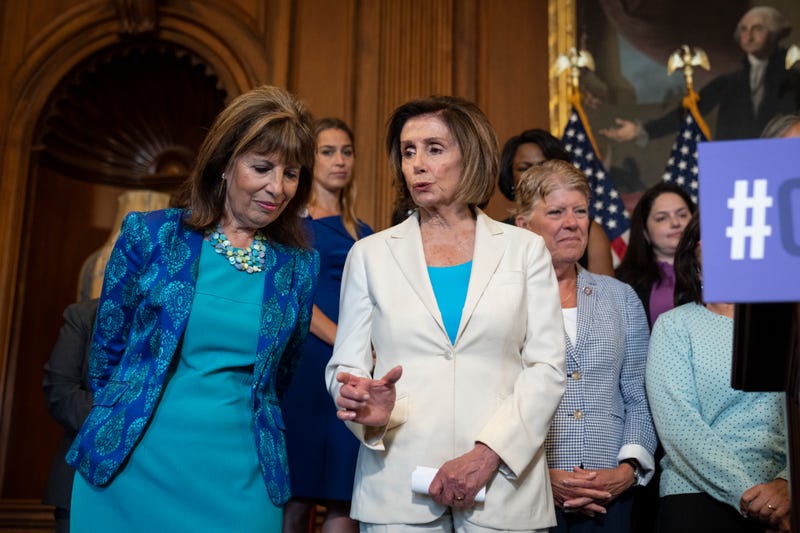 Rep. Jackie Speier (D-CA) speaks with Speaker of the House Nancy Pelosi (D-CA) during a news conference with the Democratic Women's Conference about the care economy, at the U.S. Capitol July 1, 2021 in Washington, DC.