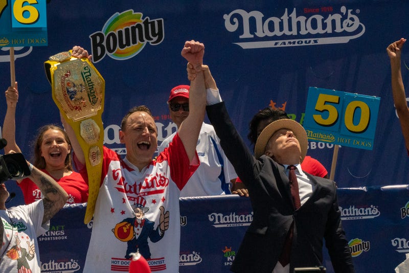 Competitive eating champion Joey "Jaws" Chestnut wins the 2021 Nathan's Famous 4th Of July International Hot Dog Eating Contest with 76 hot dogs breaking his personal best record of 75 at Coney Island on July 4, 2021 in New York City