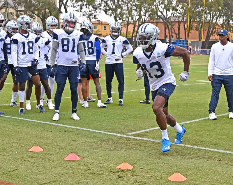 Wide receiver Michael Gallup #13 of the Dallas Cowboys runs a drill during training camp at River Ridge Complex on July 24, 2021 in Oxnard, California.