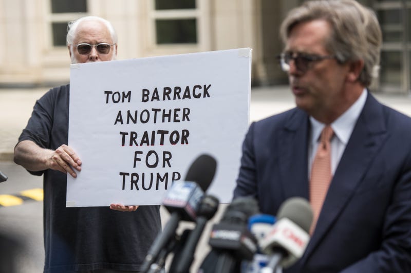 Matt Herrington, attorney for Tom Barrack Jr., founder of Colony Capital Inc., center, speaks to members of the media while departing from criminal court in New York, U.S., on Monday, July 26, 2021. Barrack pleaded not guilty to charges that he illegally lobbied the U.S. government on behalf of the United Arab Emirates and lied to investigators about it.