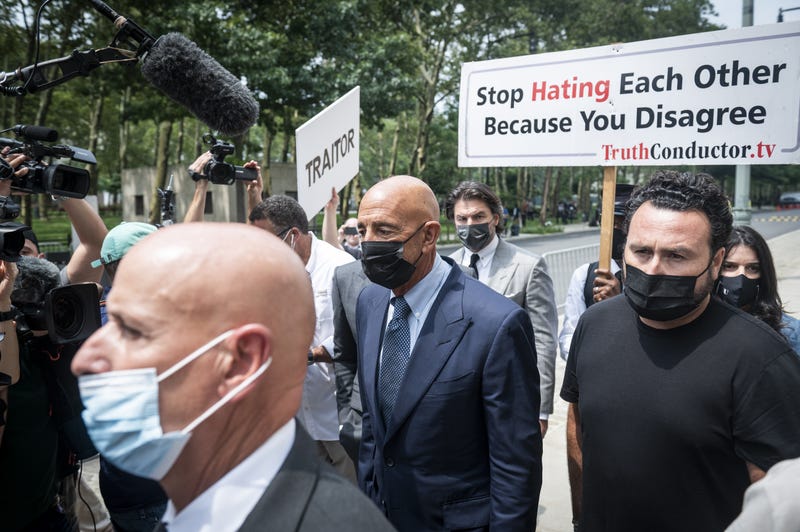 Tom Barrack Jr., founder of Colony Capital Inc., center, departs from criminal court in New York, U.S., on Monday, July 26, 2021. Barrack pleaded not guilty to charges that he illegally lobbied the U.S. government on behalf of the United Arab Emirates and lied to investigators about it.