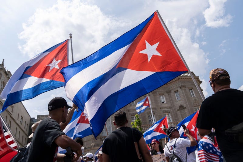 Cuban activists and supporters rally outside the Cuban Embassy during a Cuban freedom rally on July 26, 2021 in Washington, DC. Cuban activists and demonstrators held a rally to urge the American government to intervene in Cuba to support human rights and end Communism in Cuba.