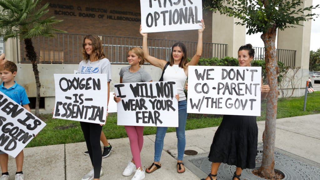 Parent arrested after threatening school board with guns during mask debate