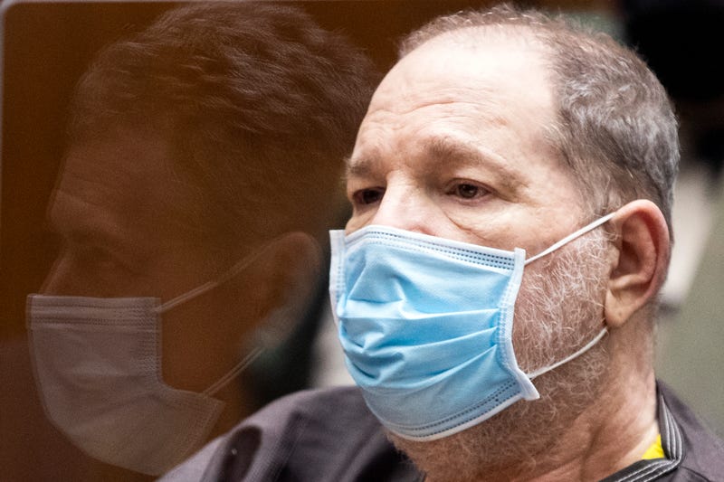 Former film producer Harvey Weinstein (R) listens in court as his attorney Mark Werksman is reflected in the glass in front of him during a pre-trial hearing for Weinstein, who was extradited from New York to Los Angeles to face sex-related charges at Clara Shortridge Foltz Criminal Justice Center on July 29, 2021 in Los Angeles, California. 