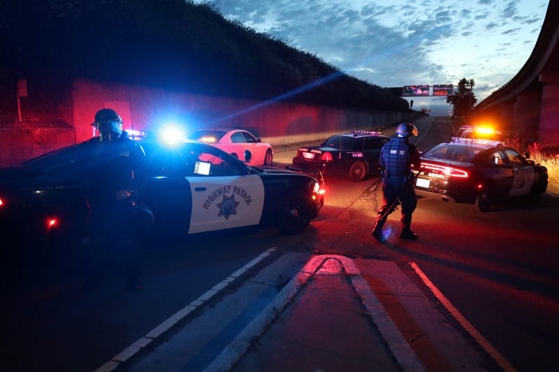 California Highway Patrol officers block a freeway entrance during a protest sparked by the death of George Floyd while in police custody on May 29, 2020 in Oakland, California.