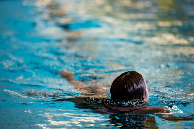 Child swimming in pool