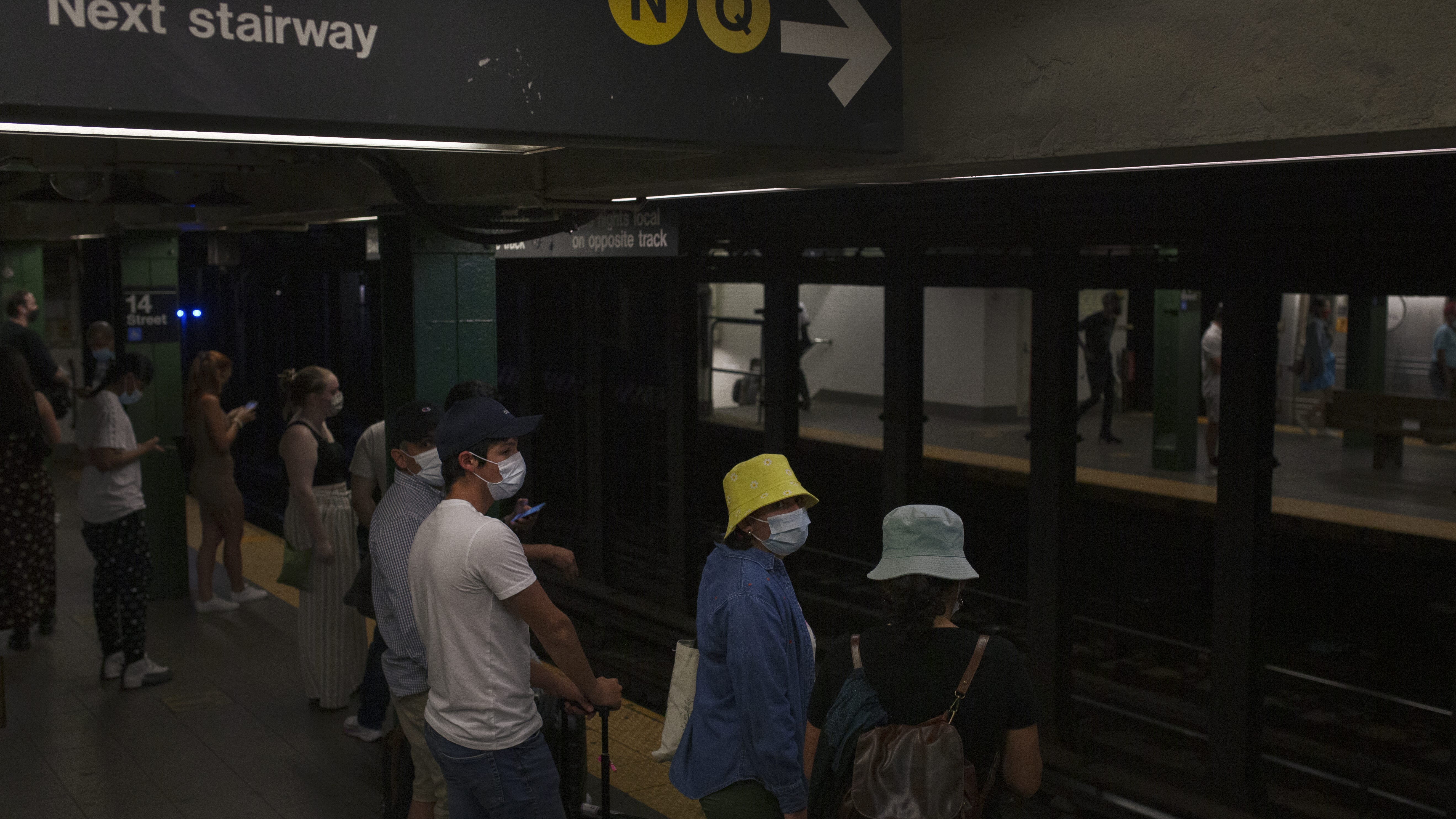 Woman survives jump in front of Q train at Union Square station