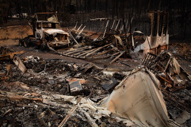 A home and garage destroyed by the Dixie Fire sits on the roadside on August 9, 2021 near Greenville, California.