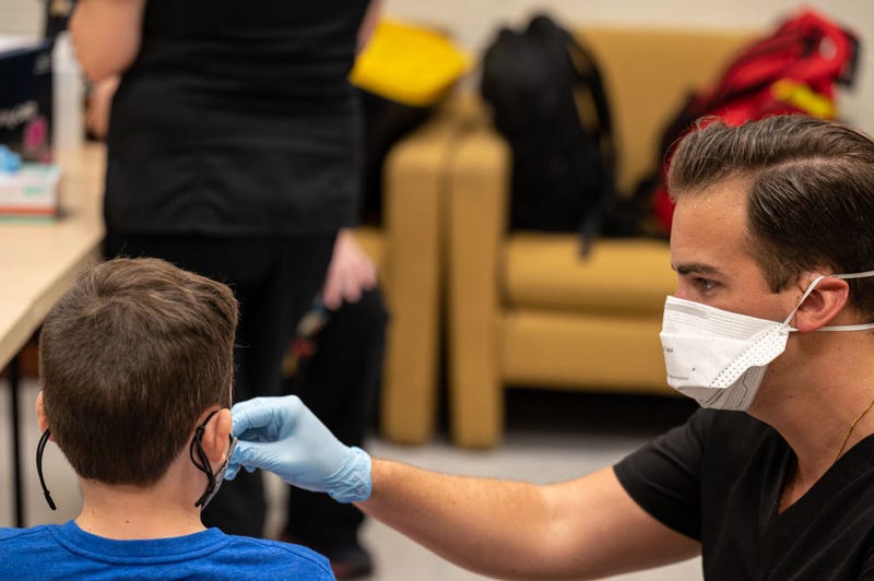 An unidentified student is administered a test by a Wild Health nurse during a COVID-19 testing day at Brandeis Elementary School on August 17, 2021 in Louisville, Kentucky. 