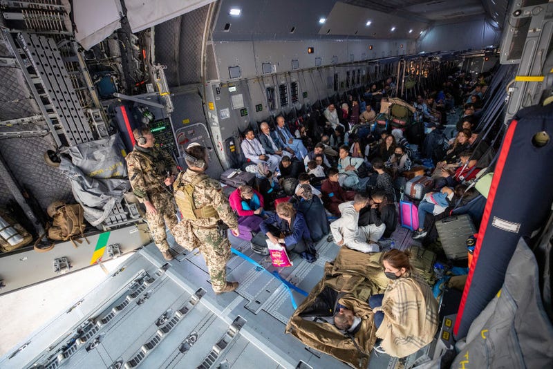 In this handout image provided by the Bundeswehr, evacuees from Kabul sit inside a military aircraft as they arrive at Tashkent Airport on August 17, 2021 in Tashkent, Uzbekistan.