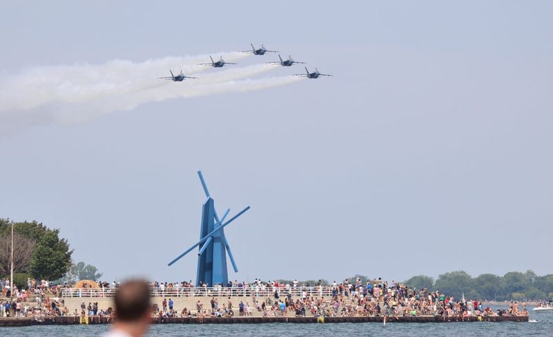 People watch aircraft performance during the Chicago Air and Water Show 2021 in Chicago, the United States, on Aug. 21, 2021. Chicagoans on Saturday raised their eyes to the skies as the Chicago Air and Water Show 2021 came back in a "reimagined" version. The free and reimagined air show events are part of the Chicago mayor's "Open Chicago" initiative to safely and fully reopen the third largest U.S. city.