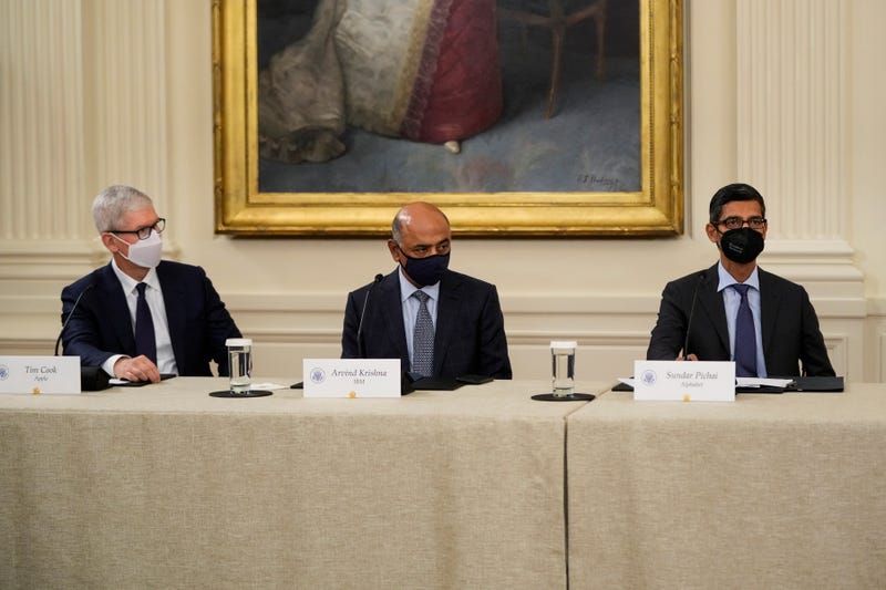 Apple CEO Tim Cook, IBM CEO Arvind Krishna and Google CEO Sundar Pichai listen as U.S. President Joe Biden speaks during a meeting about cybersecurity in the East Room of the White House on August 25, 2021 in Washington, DC. 