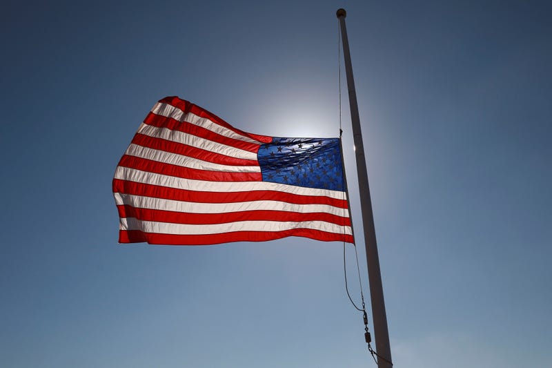 A U.S. flag flying at half-staff.