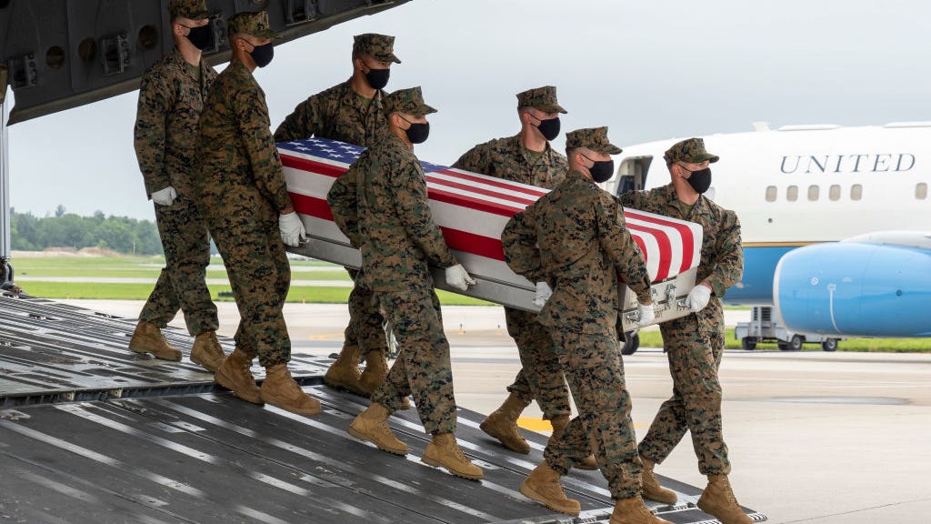 Marine from Sacramento who cradled baby in famous 'I love my job' pic killed in Afghanistan