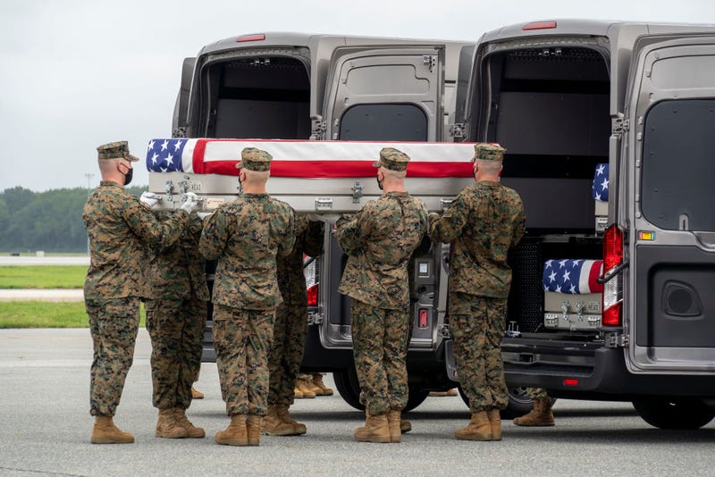 In this handout photo provided by the U.S. Air Force, a U.S. Marine Corps carry team transfers the remains of Marine Corps Lance Cpl. Kareem M. Nikoui of Norco, California, Aug. 29, 2021 at Dover Air Force Base, Delaware. Nikoui was assigned to 2nd Battalion, 1st Marine Regiment, 1st Marine Division, I Marine Expeditionary Force, Camp Pendleton, California