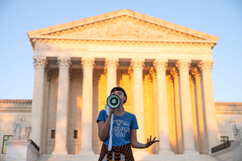 An activist, who declined to provide her name, speaks outside the Supreme Court in protest against the new Texas abortion law that prohibits the procedure around six weeks into a pregnancy on September 2, 2021 in Washington, DC.