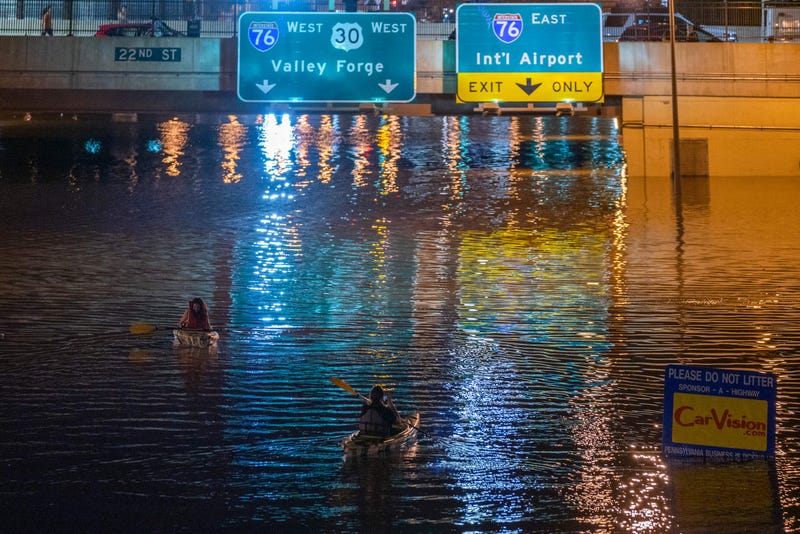 A kayaker paddles down a portion of I-676 in Philadelphia after flooding from Hurricane Ida's heavy rains in September 2021.