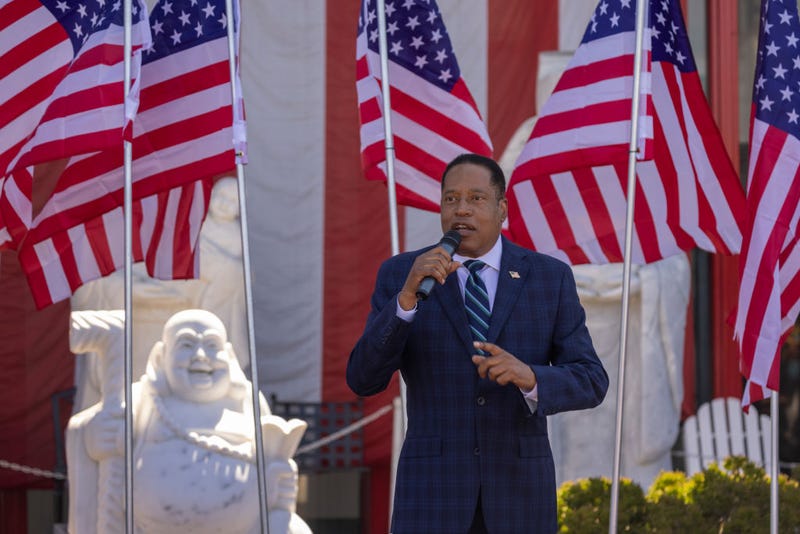 Republican recall candidate Larry Elder addresses the "Asian Rally for Yes on Recall" at the Asian Garden Mall on Sept. 4, 2021, in Westminster, California. Actress Rose McGowan endorsed Elder on Sunday and alleged that Gov. Gavin Newsom's wife tried to cover up her allegations of sexual assault against Harvey Weinstein.