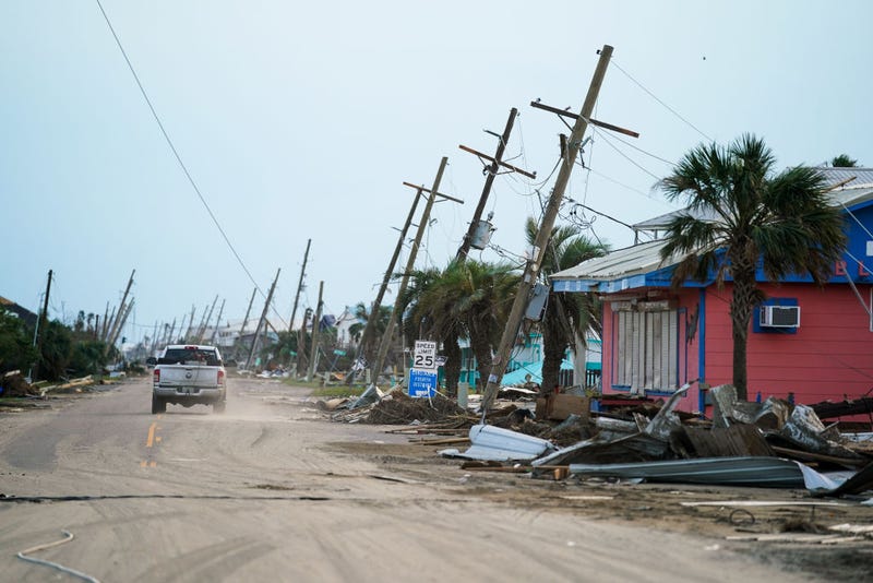 A motorist drives down a road in the wake of Hurricane Ida on September 4, 2021 in Grand Isle, Louisiana. Ida made landfall as a Category 4 hurricane six days before in Louisiana and brought flooding, wind damage and power outages along the Gulf Coast. (Photo by Sean Rayford/Getty Images)