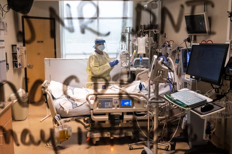 Notes indicating the patient has a "do not resuscitate" order are written on the window of a patient's room in the COVID-19 Intensive Care Unit at Three Rivers Asante Medical Center on September 9, 2021 in Grants Pass, Oregon.