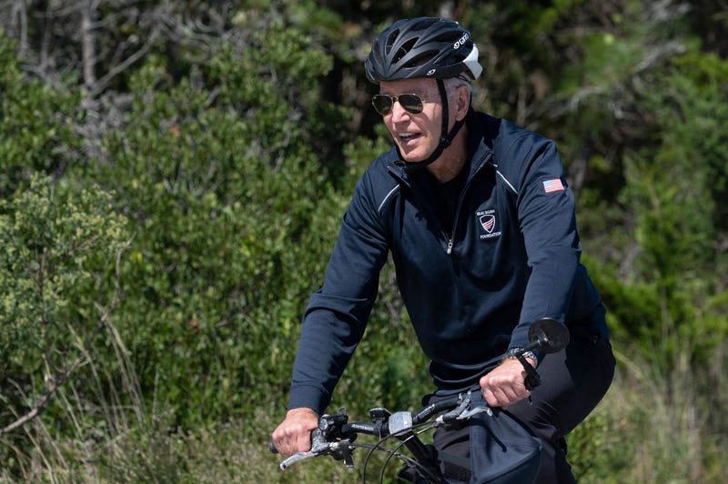 US President Joe Biden rides his bike through Cape Henlopen State Park in Rehoboth Beach, Delaware, on September 19, 2021.