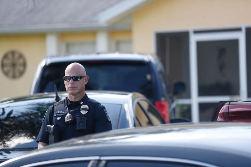 A police officer stands outside the home of Brian Laundrie, who is a person of interest after his fiancé Gabby Petito went missing on September 20, 2021 in North Port, Florida.