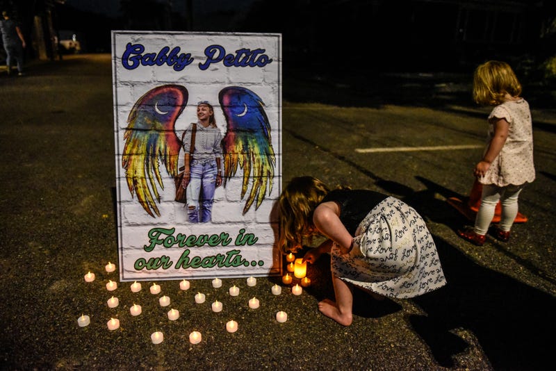 Two children gather to honor the death of Gabby Petito on September 24, 2021 in Blue Point, New York.
