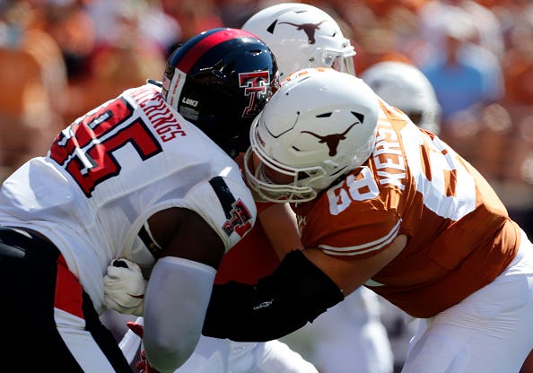 AUSTIN, TX - SEPTEMBER 25: University of Texas Long Horns offensive lineman Derek Kerstetter (68) blocks Texas Tech Red Raiders defensive lineman Jaylon Hutchings (95) during the game on September 25, 2021, at Darrell K Royal - Texas Memorial Stadium in Austin, TX.