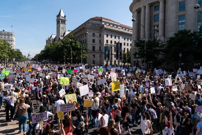 Women rights activists march to the U.S. Capitol during the annual Womens March October 2, 2021 in Washington, DC. The Women's March and other groups organized marches across the country to protest the new abortion law in Texas.