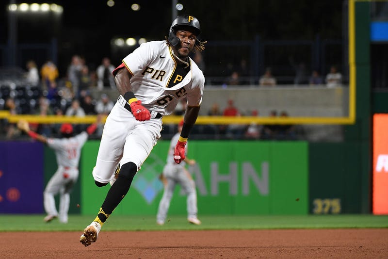 Oneil Cruz #61 of the Pittsburgh Pirates advances on a two-run RBI triple by Wilmer Difo #15 in the fifth inning