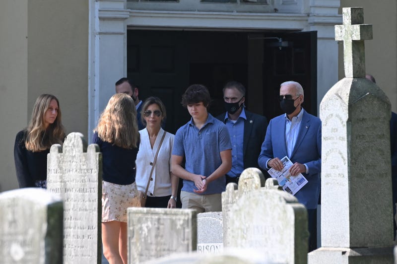 US President Joe Biden walks with his grandchildren in Wilmington, DE, on October 3, 2021, after leaving St. Joseph on the Brandywine church.