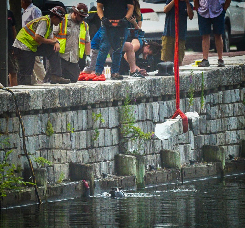 A piece of the Christopher Columbus statue is pulled from the harbor in Baltimore on July 6, 2020. (Jerry Jackson/Baltimore Sun/Tribune News Service via Getty Images)