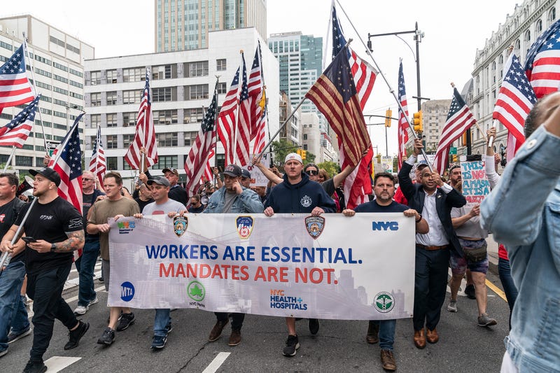 Municipal workers of the city march across Brooklyn bridge and rally at City Hall Park against vaccination mandate.