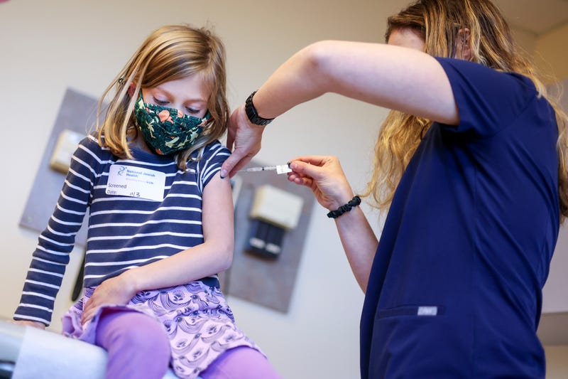 File photo: A COVID-19 vaccine is administered to a 6-year-old girl in Denver, Colorado, on November 3, 2021