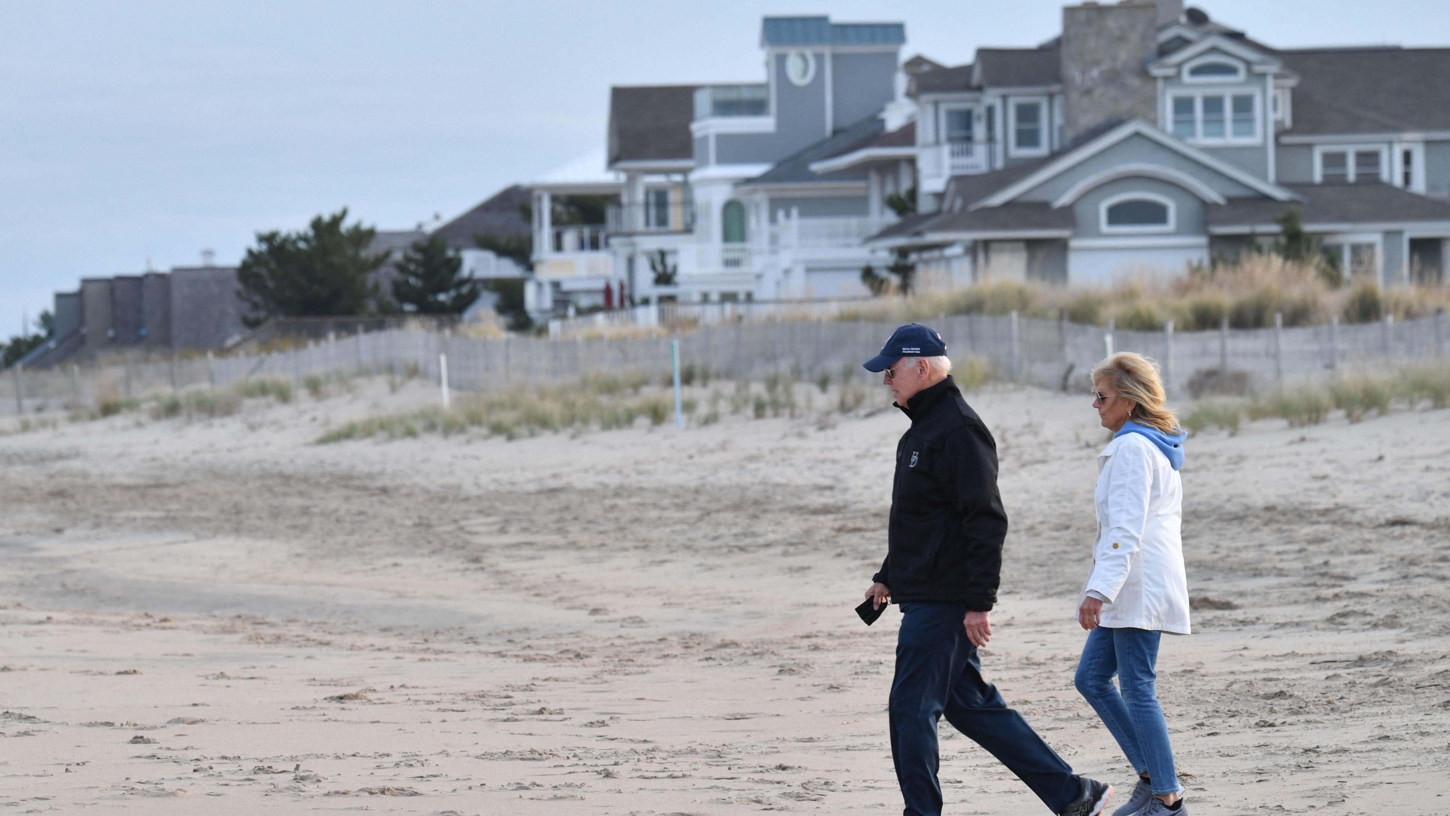 VIDEO & PHOTOS: Bidens go for stroll along Delaware beach, embrace and take selfie